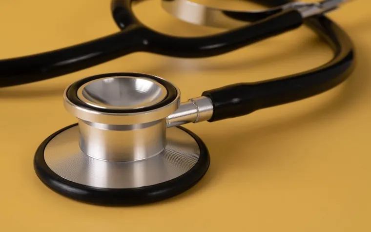A stethoscope resting on a veterinary exam table