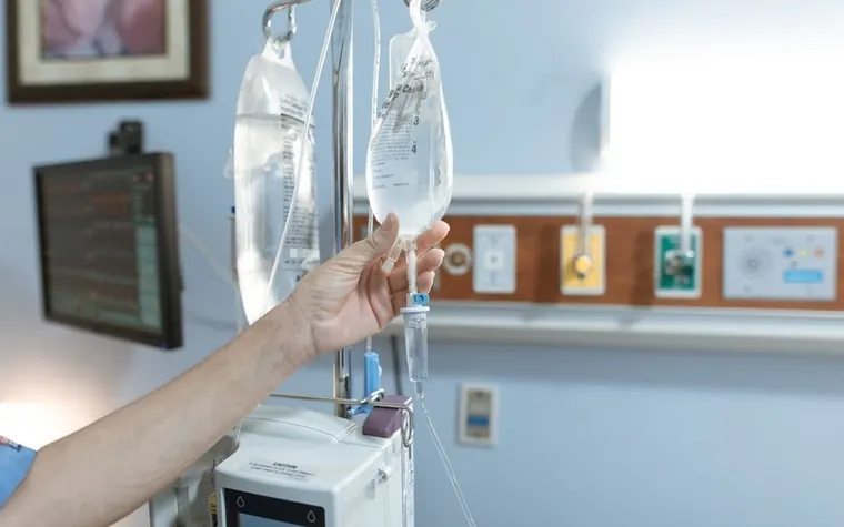 IV fluid bags hanging in a veterinary hospital hallway
