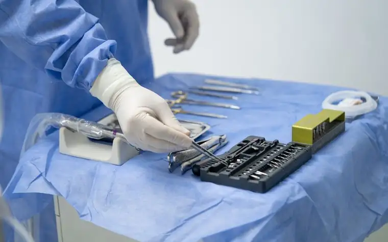 Surgical instruments laid out in an operating room before a procedure